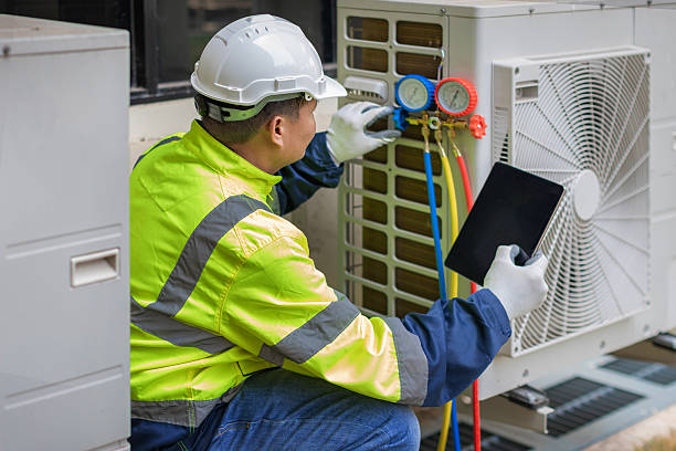 Professional Heat Pump Repair technician working in Lakeshore, FL